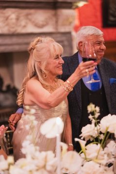 Guest toasting during dinner