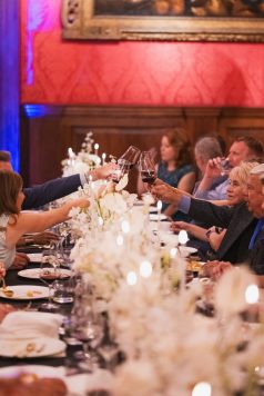 Guests toasting during dinner