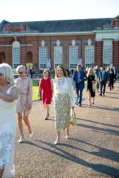 Guests walking across Kensington Palace grounds
