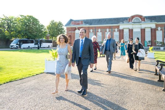 Guests enjoying a walk across Kensington Palace grounds