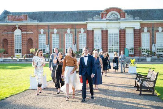 Guests walk the Kensington Palace grounds