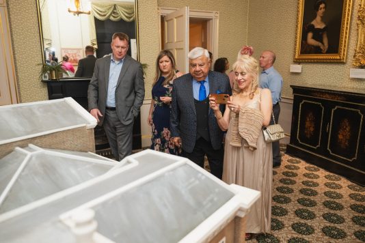 Guests appreciating museum exhibit