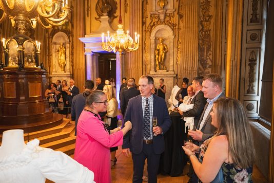 Guests mingling at Kensington Palace reception