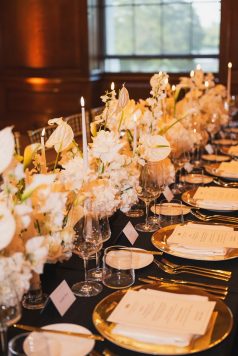 Floral centerpiece on formal dinner table