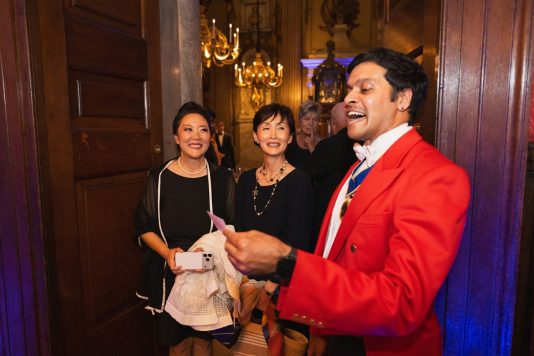 Speaker welcoming guests at Kensington Palace