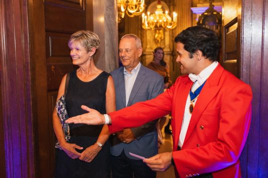 Speaker welcoming guests at reception