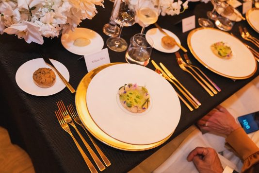 Overhead view of a plated appetizer at an elegant dining table