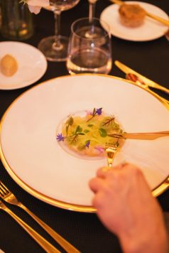Plated appetizer with edible flowers