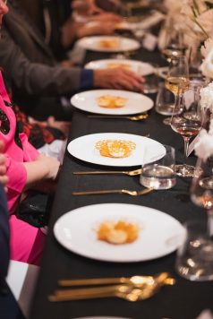 Row of plated appetizers at a formal dining event
