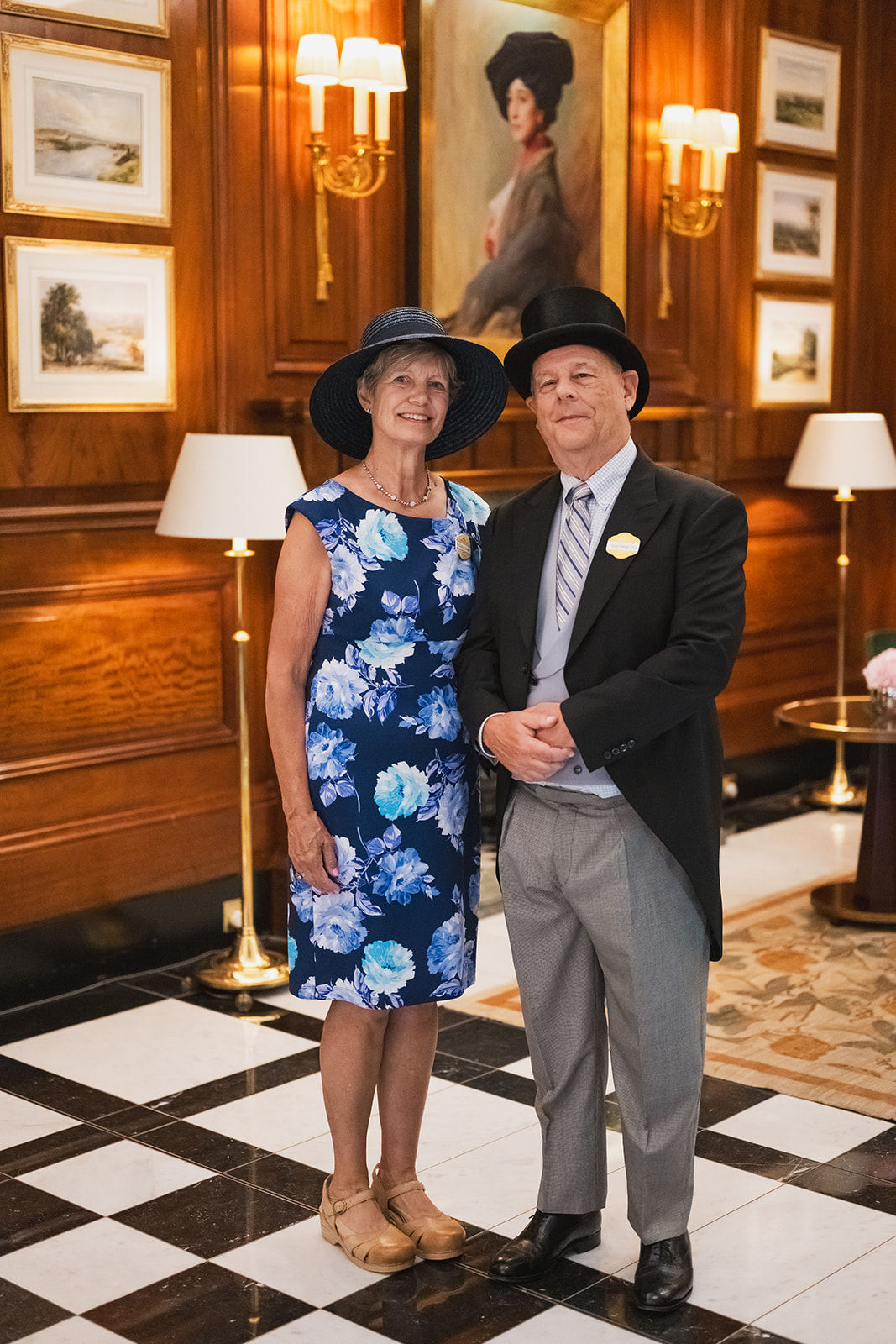 Blue floral dress beside wood paneling