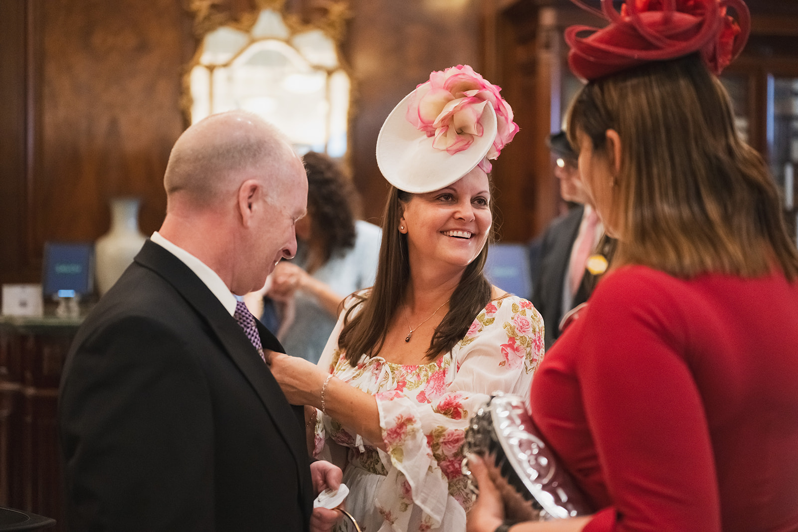 Conversation beneath decorative fascinators