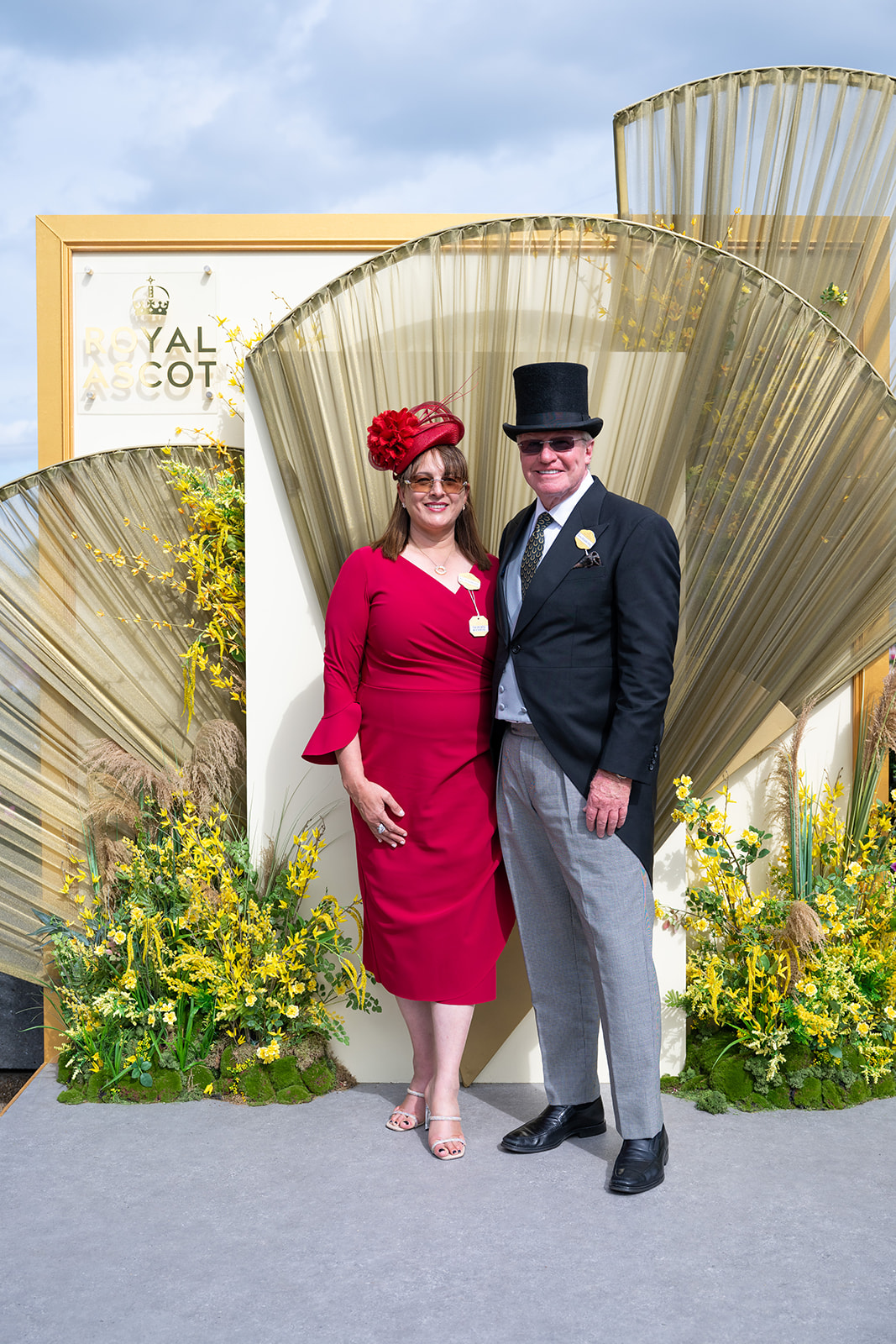 Red dress beneath gold fan backdrop