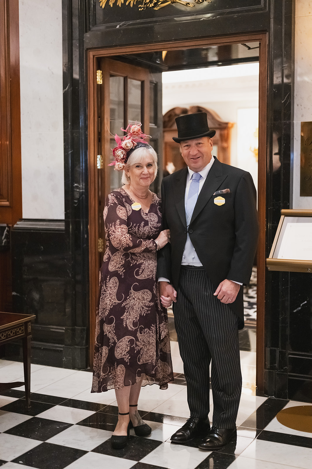 Guests posing in formal Ascot attire