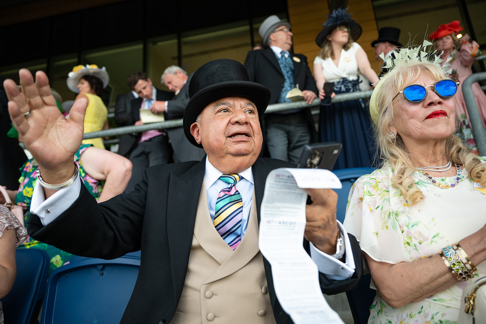 Holding betting slip in grandstand