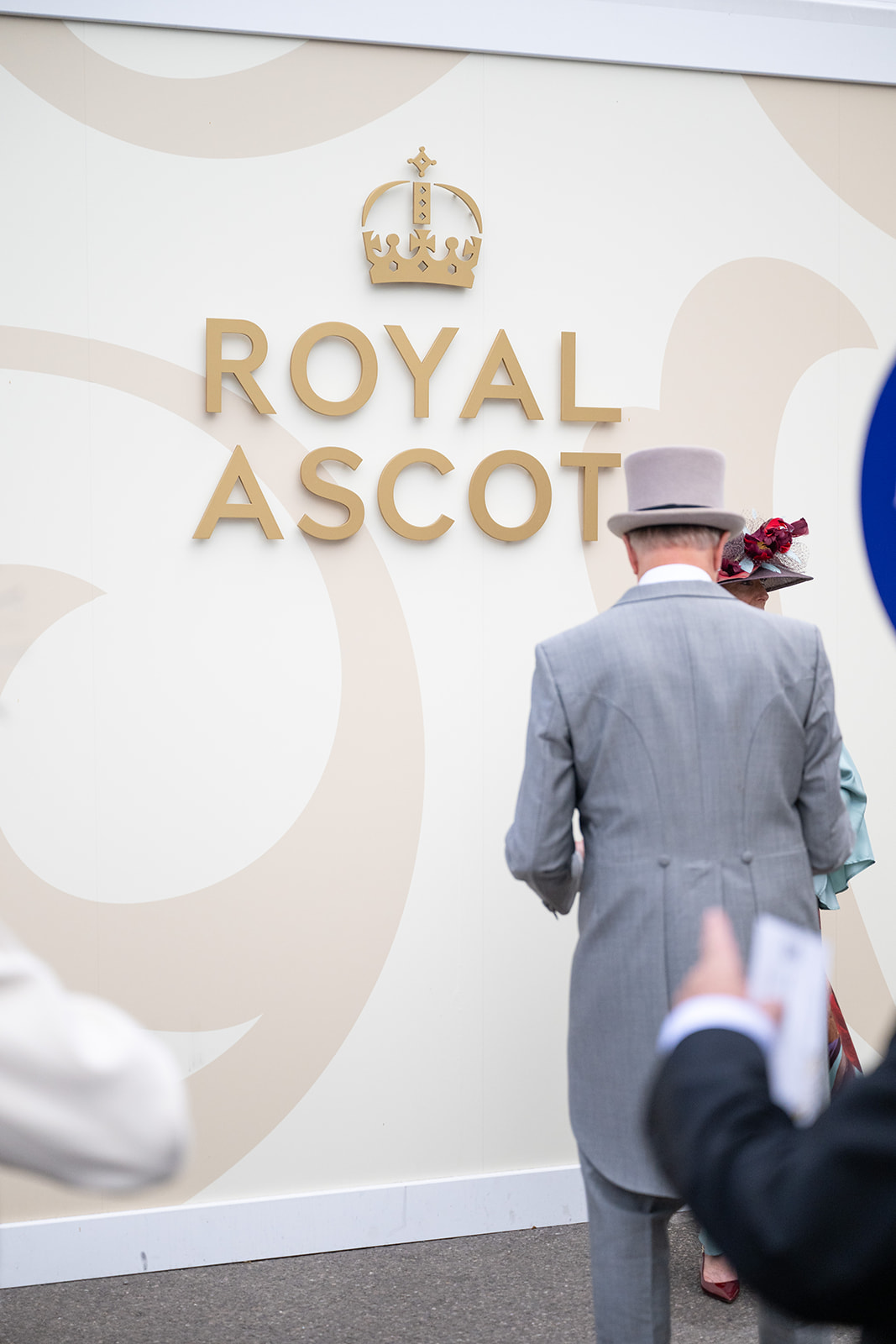 Royal Ascot backdrop with event attendees