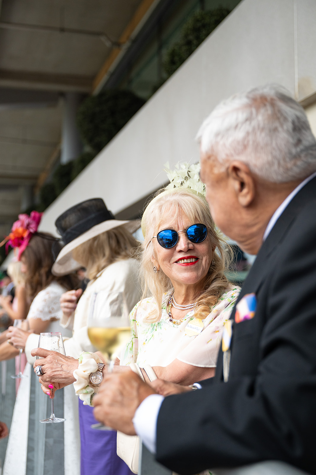 Attendee wearing blue mirrored sunglasses