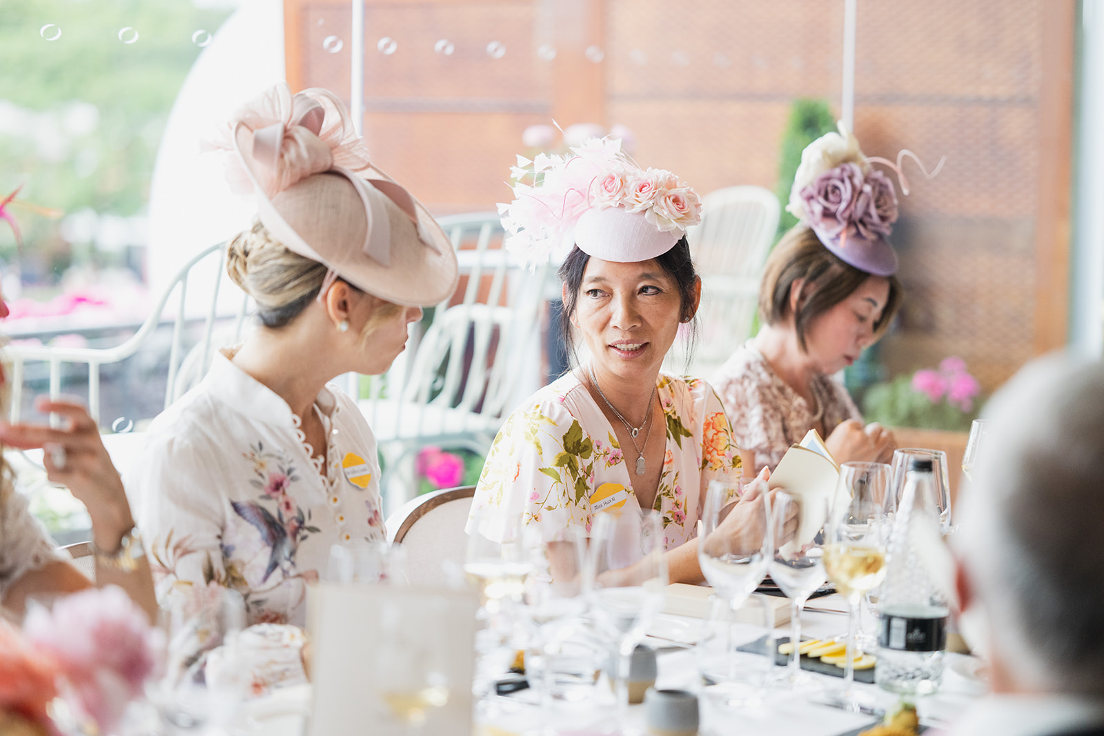 Decorative fascinators at luncheon table