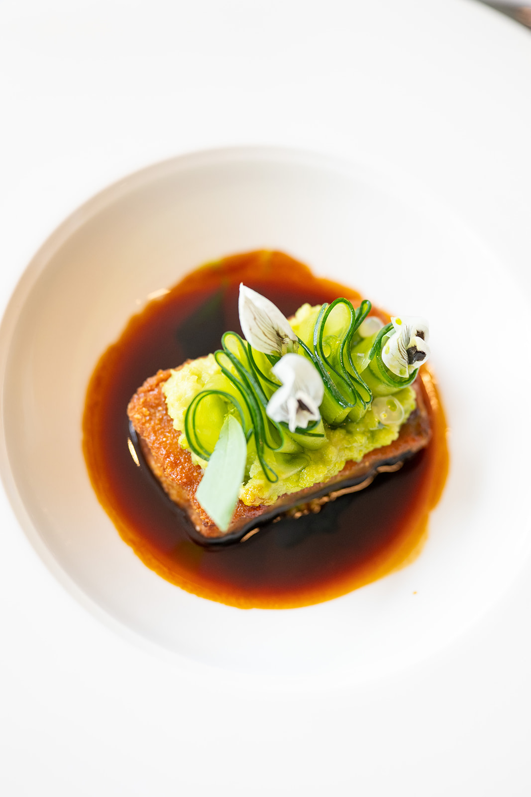 Seared entrée with green vegetable ribbons