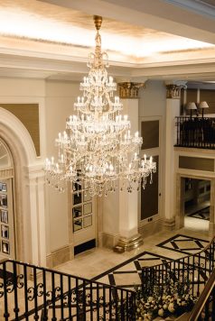 Close-up of crystal chandelier in bright interior.