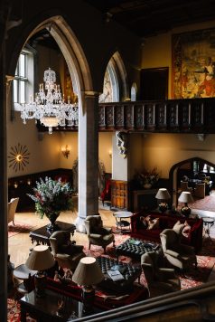 Elegant interior with staircase and chandelier.