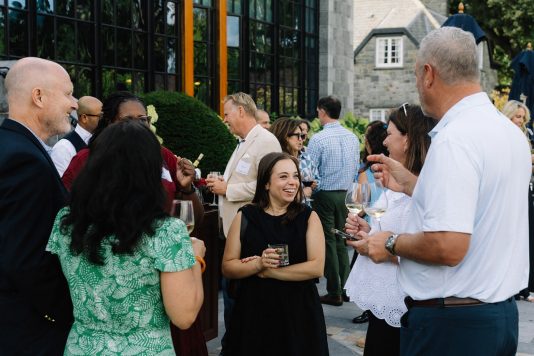 Guests socializing outside venue.