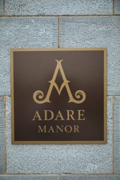 Adare Manor logo sign on wall.