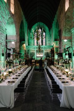 Cathedral interior with long dining tables.