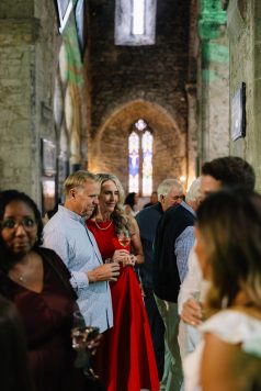 Guests mingling during an indoor cocktail hour.