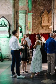 Guests socializing near an exterior doorway.