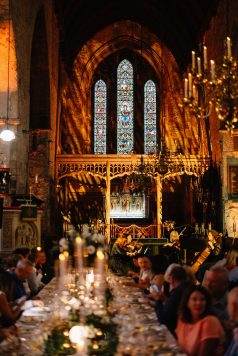 Cathedral interior glowing with warm lighting.