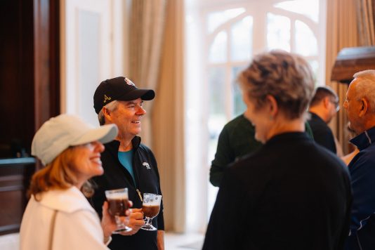 Guests socializing during an indoor reception.