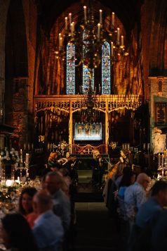 Cathedral decorated with warm lighting for dinner.