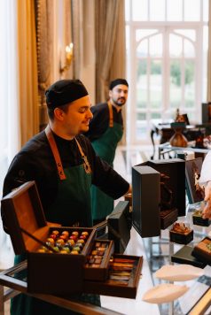 Bartender preparing a drink behind the bar.