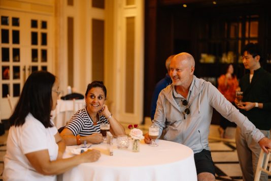 Guests dining together at a round table.