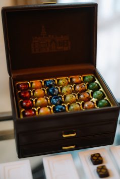 Box of colorful chocolates on display.