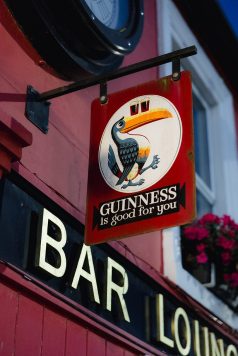 Guinness sign displayed outside a pub.