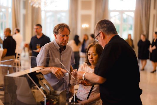 Guests browsing items at the Waterford display.