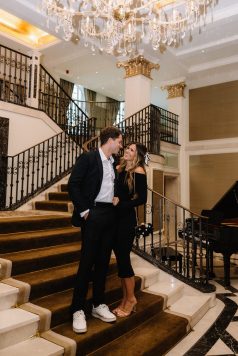 Two guests walking down an indoor staircase.