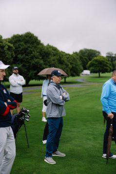 Guests observing activity on the course.