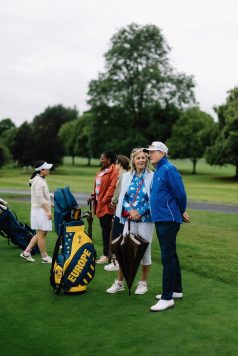 Guests standing together on the course.