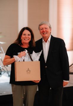 Guest holding an Adare Manor gift bag.