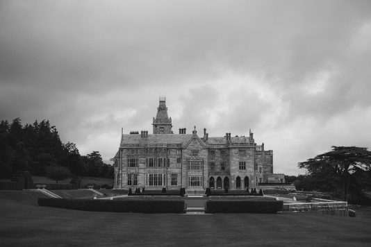 Black-and-white view of Adare Manor exterior.