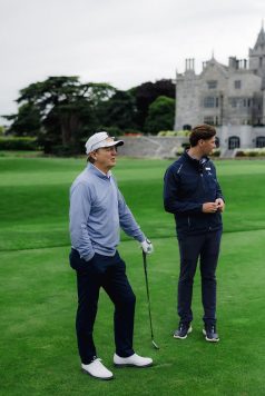 Two guests talking on the fairway.