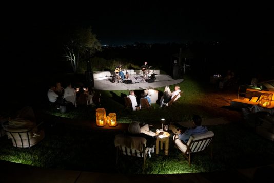 Guests enjoying outdoor evening concert