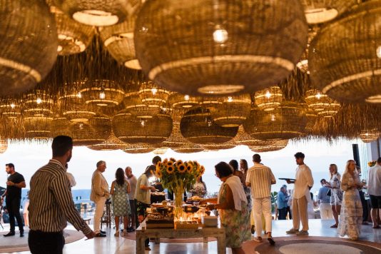 Dinner buffet under woven pendant lights