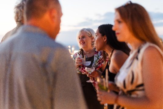 Guests talking during an outdoor reception