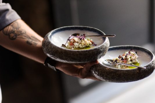 Plated appetizers being served in bowls