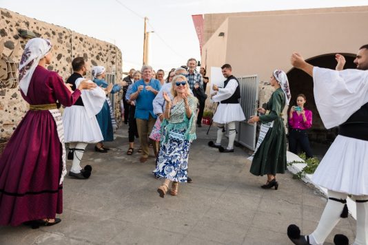 Guests enter venue greeted by staff in traditional garb