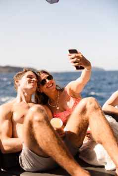Guests taking a selfie on a boat