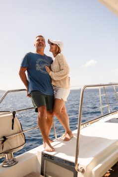 Guests standing together on a boat